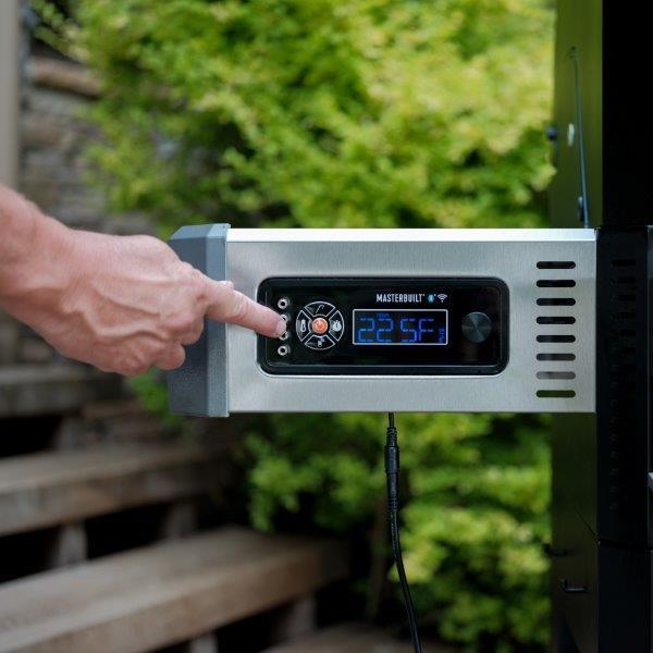 Set temperature and time on digital control panel mounted on the left side of the BBQ