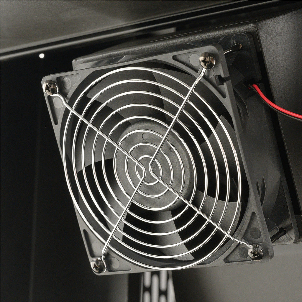 Closeup of the DigitalFan used to maintain desired cooking temperature. The fan is in a black housing with a metal protective cover.