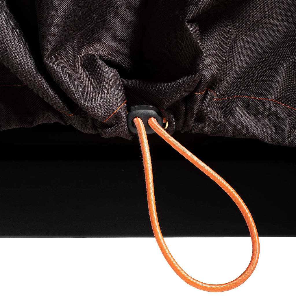Extreme close-up of the orange cinch cord. The cord is adjustable, with a black cinch-lock. A bit of the cord loops out the front of a gap in the cover to make it easily adjustable.