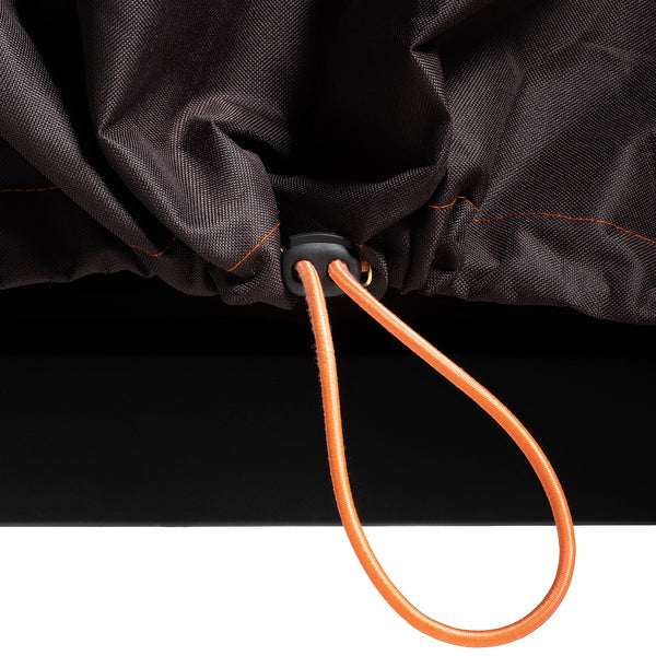 Extreme close-up of the orange cinch cord. The cord is adjustable, with a black cinch-lock. A bit of the cord loops out the front of a gap in the cover to make it easily adjustable.