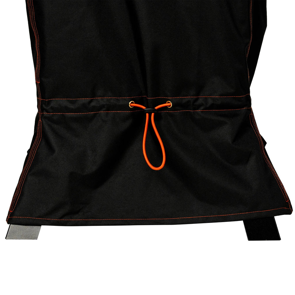 Close-up of the bottom of the cover with the foldable skirt extended to cover the smoker's legs and the drawstring pulled tight around the tops of the legs.
