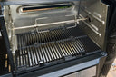 Rotisserie spit rod and meat claw installed in a Gravity Series BBQ + Smoker